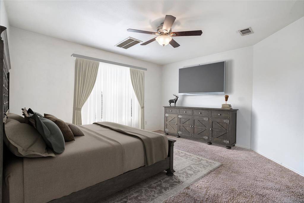 The master bedroom boasts and ensuite bath with a double vanity, walk-in closet, garden tub, and shower.