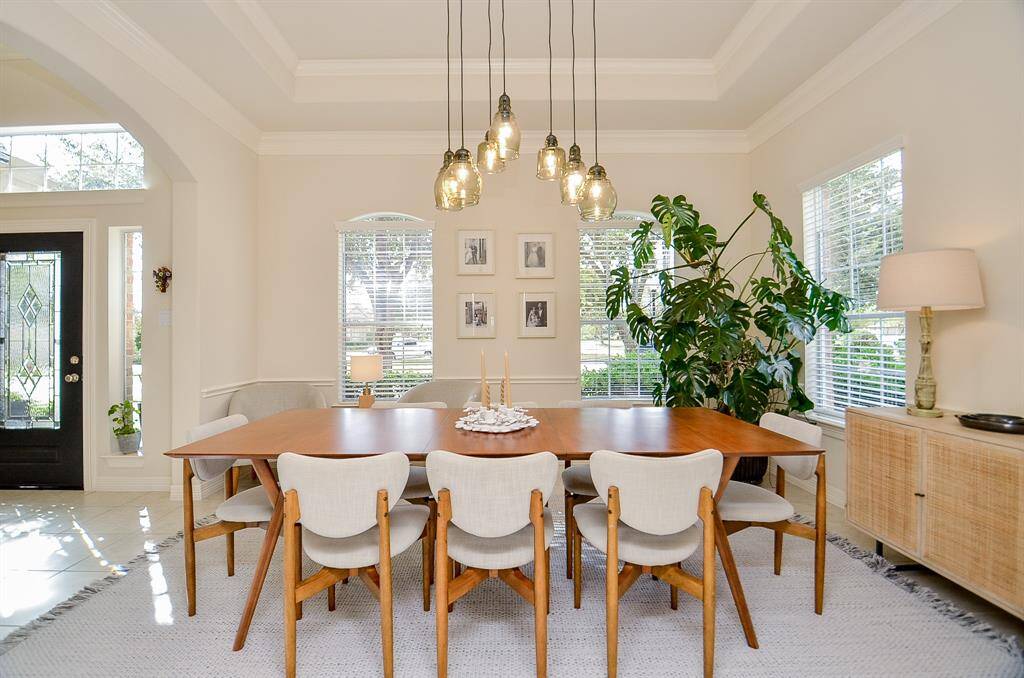 New light fixtures by Shades of Light were installed throughout the house in 2023. The tray ceiling with crown molding completes the refined look.