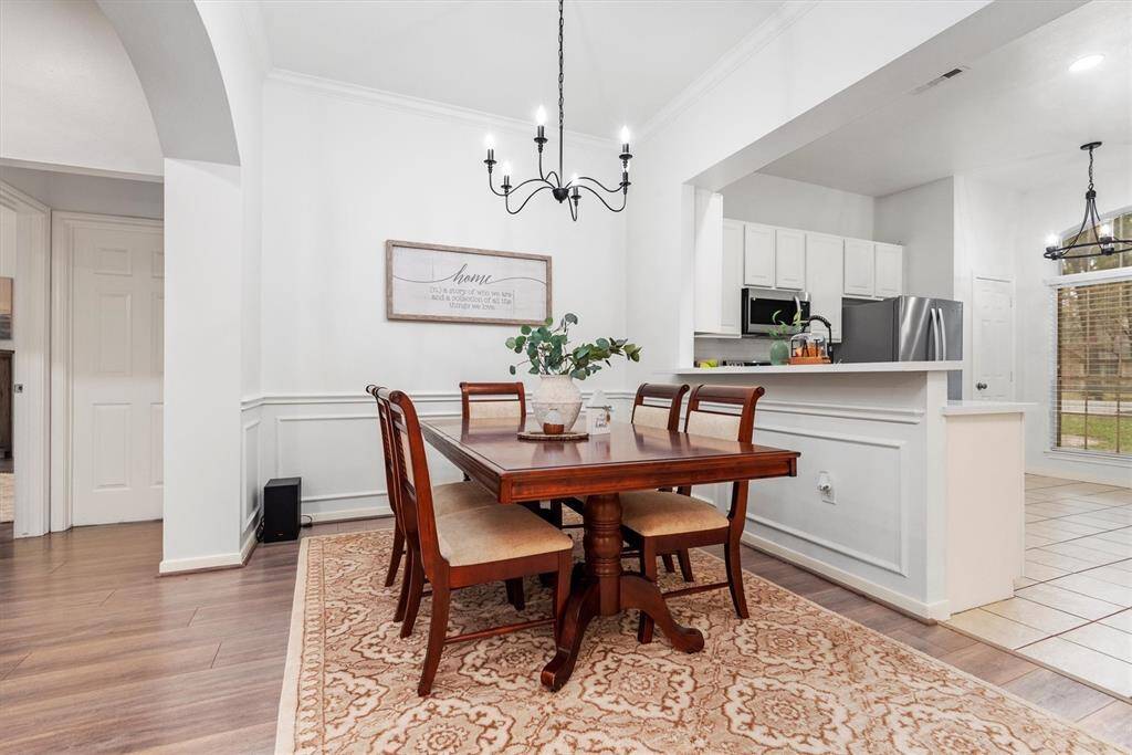 The spacious family dining area is seamlessly connected to the kitchen and living space, perfect for gatherings and everyday living. I can see a family dinner or a great game of dominoes enjoyed right here.  Need office space or more room for the kids to play indoors?  Move a table to the kitchen and use this as extended space.