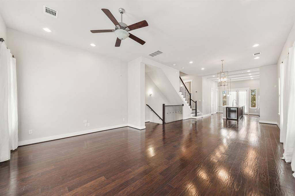 A view of the formal dining room & kitchen from the living room.