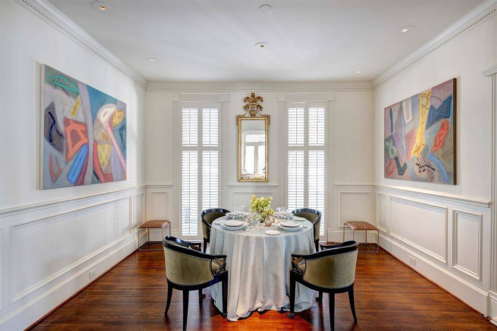 The dining room’s timeless elegance provides the ideal setting for both intimate dinner parties and large gatherings, where history and charm blend seamlessly with modern-day entertaining. With its warm ambiance and architectural beauty, this space is both inviting and unforgettable.