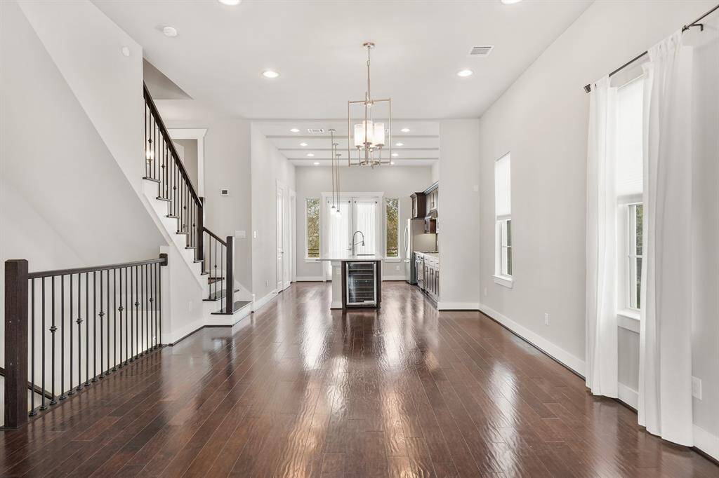 Features include recessed lighting, chandelier lighting & hardwood flooring.