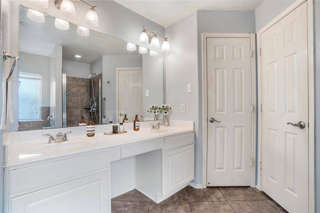 Double sinks, a makeup area, garden tub, separate shower, a private toilet area, and walk-in closet are the exceptional features of the master suite.