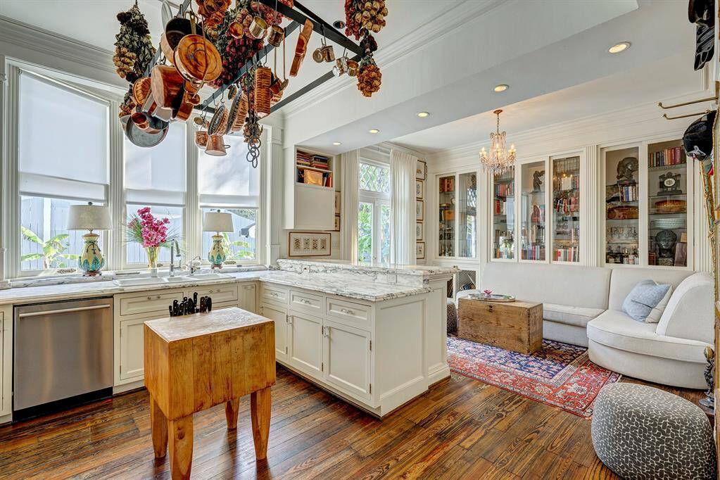 The kitchen has custom cabinetry, crafted with exquisite attention to detail, provides ample storage while enhancing the kitchen's refined aesthetic. The space seamlessly combines luxury with comfort, offering an open flow to a cozy breakfast room, ideal for casual dining and morning coffee. This kitchen is perfect for cooking, entertaining, and savoring life’s special moments.
