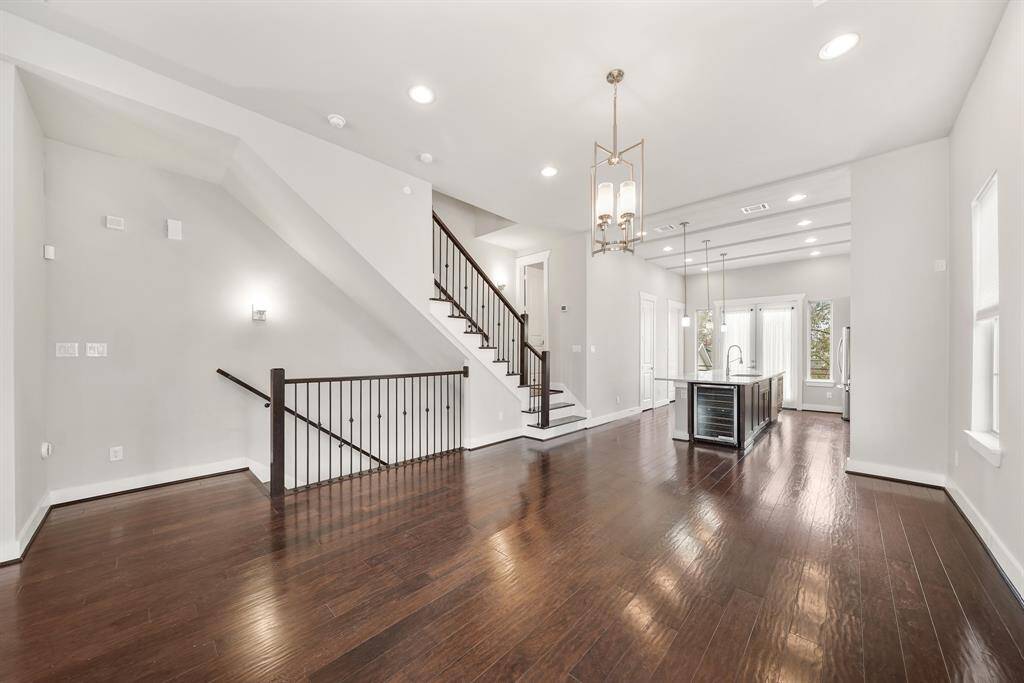 Ideal for casual to formal entertaining, this dining space is filled with natural light from windows overlooking the side yard.