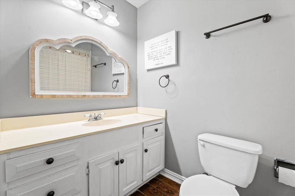Full bathroom in hall between secondary bedrooms.