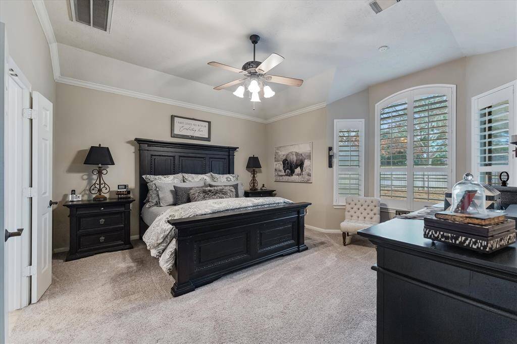 Primary bedroom with bay sitting area