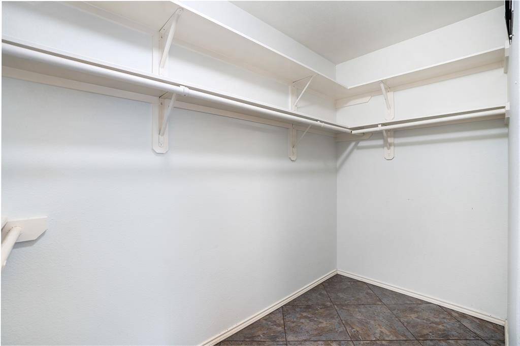 The walk-in closet of the master suite.