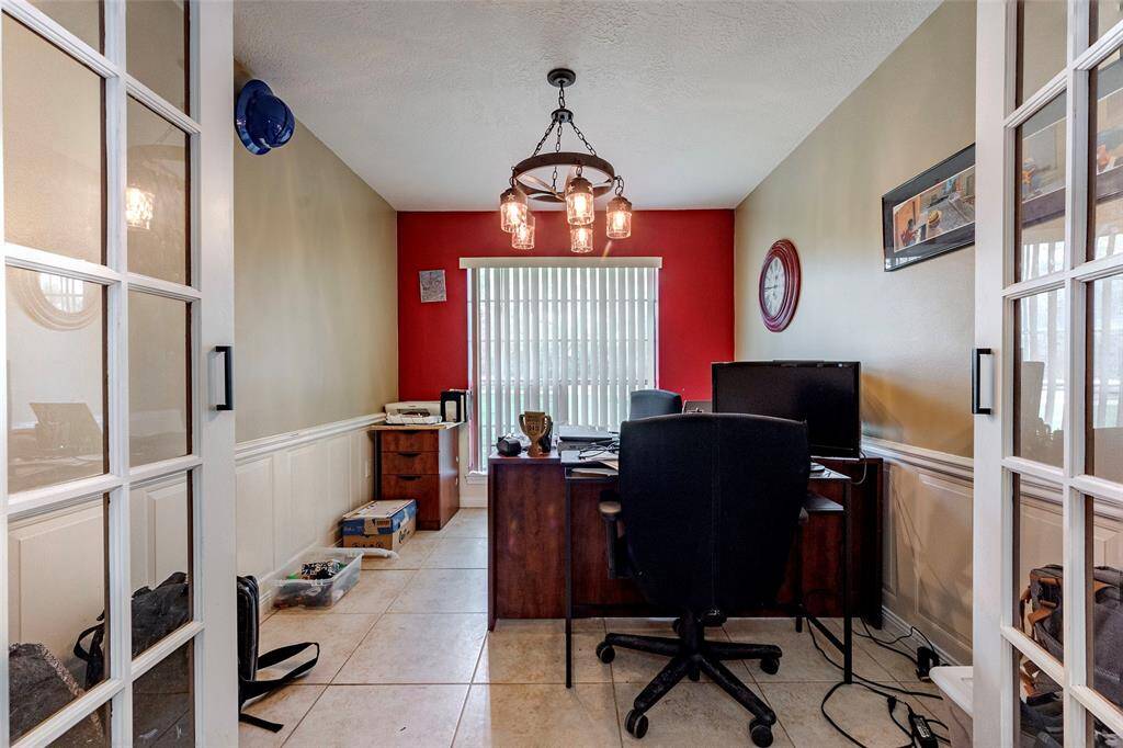 This is 1 of the offices that is located off the kitchen.