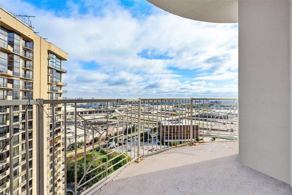 The wraparound balcony is right off the living room and has panoramic views of the city.