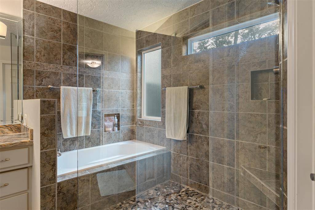 Primary en-suite: CUSTOM shower and BUILT-IN bathtub