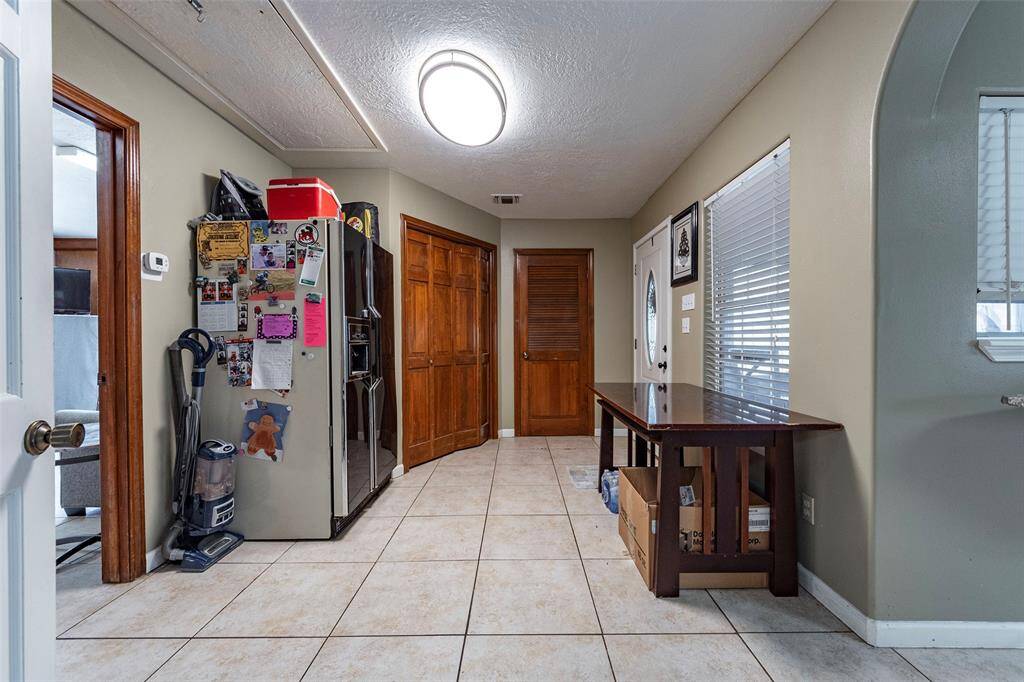 The mudroom has a 2nd pantry and storage.