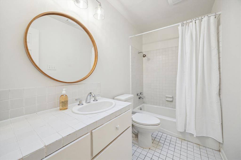 [Bathroom for Bedroom Two and Three] Hall bathroom with and tub/shower combo.