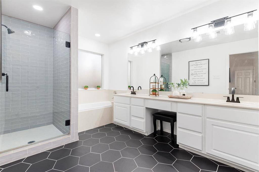 If you thought your oasis had ended it has not.  This spa like bathroom is a dream.  The hexagonal black tile is an accent piece of it's own. Note how the homeowner has matched the black fixtures to the tile to enhance that pop of color.