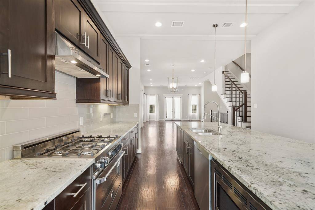 Included is a plenty of cabinet, counter & drawer storage along with a pull-out trash storage area, storage closet with shelving and a spacious walk-in pantry.