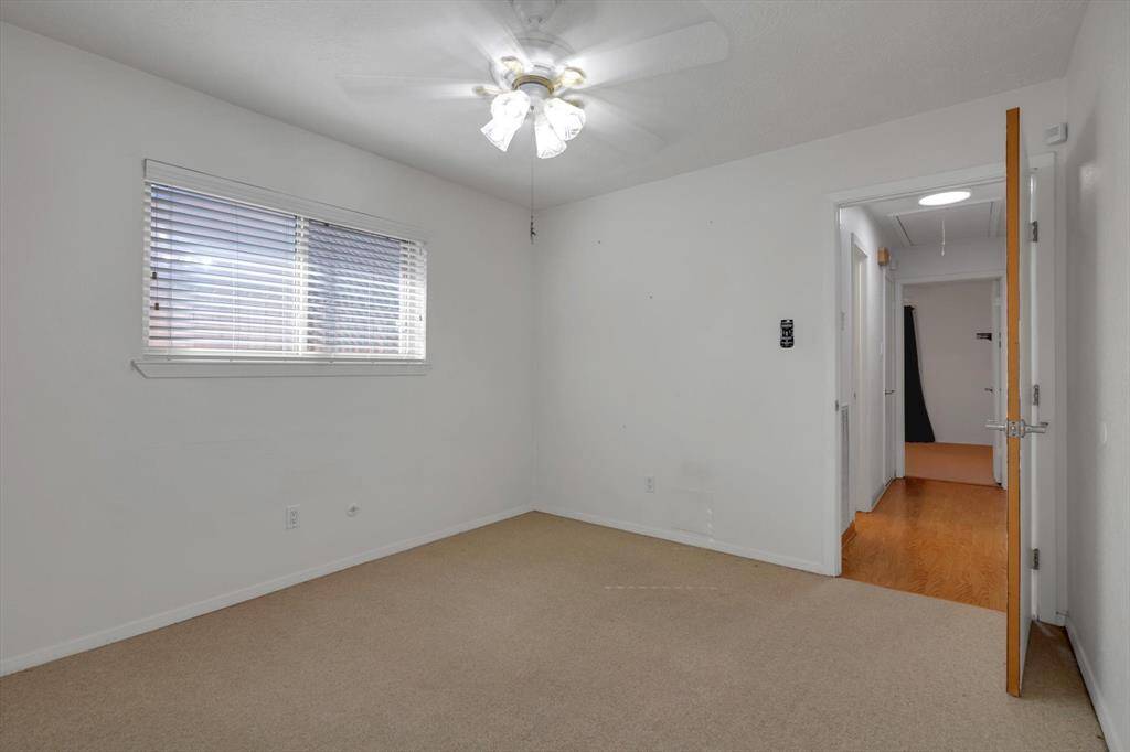 Back bedroom features walk-in closets.