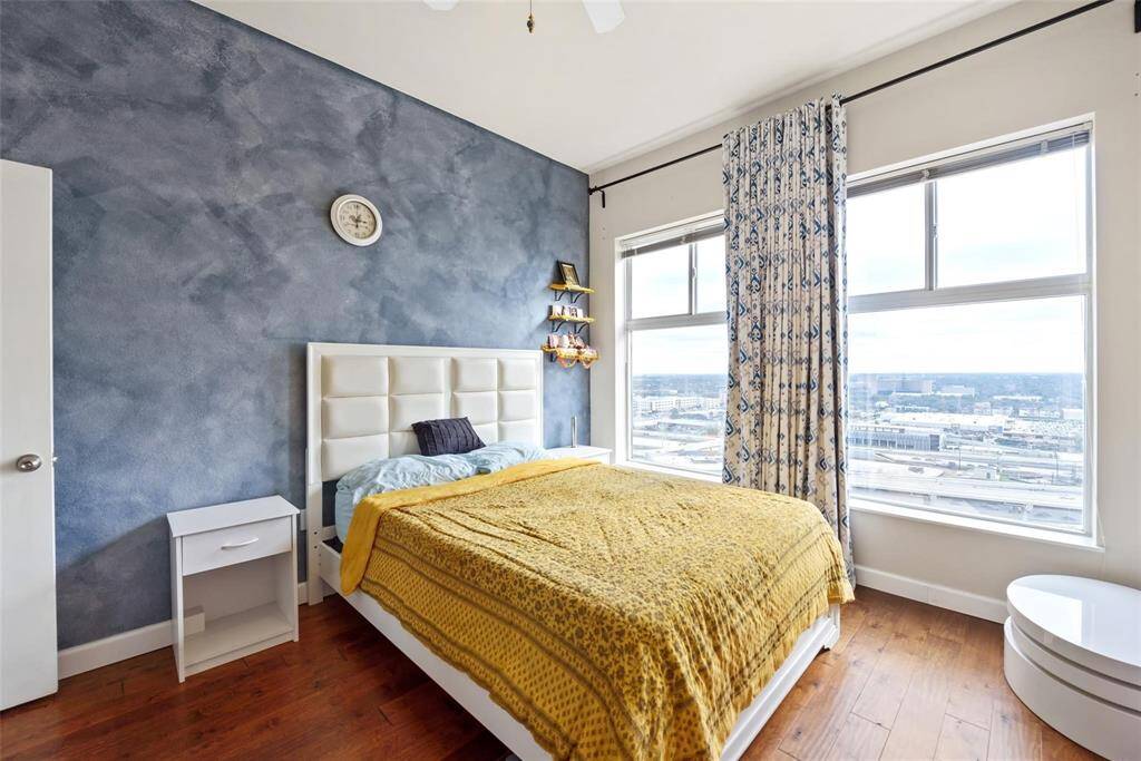 The second bedroom is large - no carpet here either. The blue wall is now a neutral color.