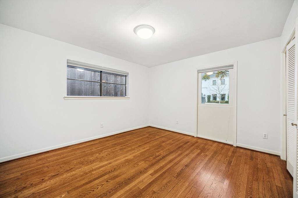 [Bedroom Three] Hardwood floors and good storage.