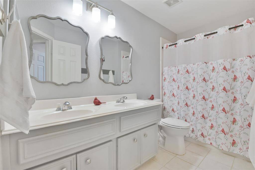Full bathroom in the shared front hallway.