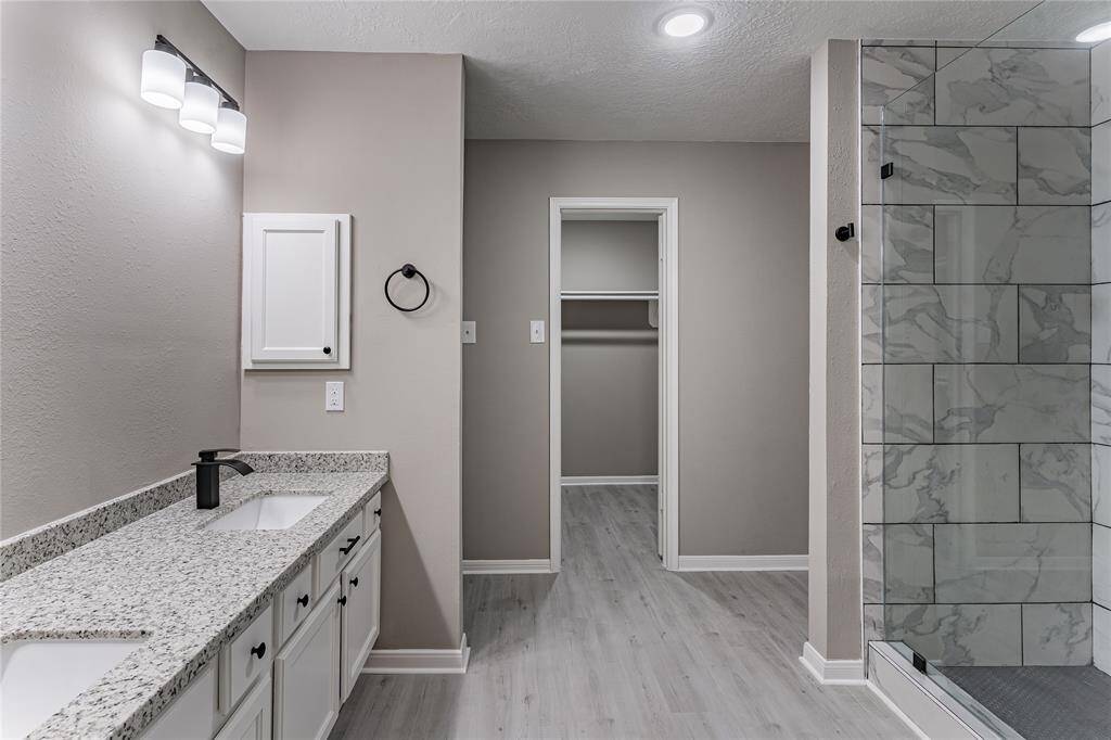 Fully remodeled primary bath with modern finishes.