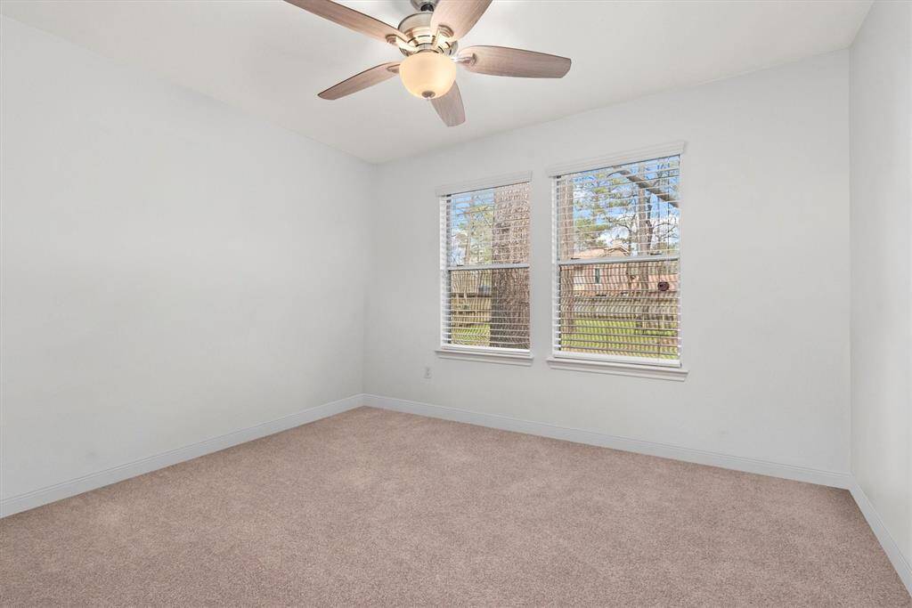One of 2 secondary bedrooms.  Both secondary bedrooms come with ceiling fans on remotes, fresh neutral paint and recently replaced carpet.