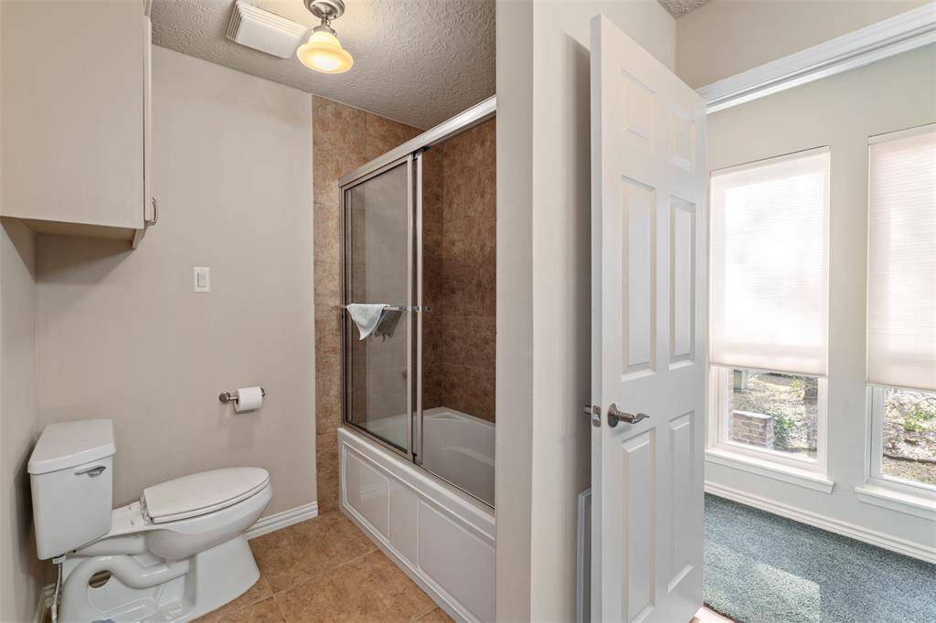 Secondary bathroom upstairs with a shower/tub COMBO