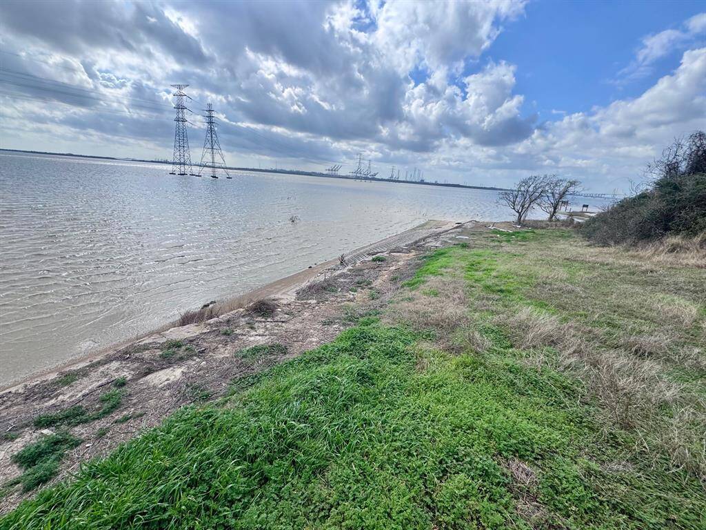52 acre tract has Tabbs Bay frontage and extends all the way down Evergreen to Tri City Beach Road. There is concrete bulkheading