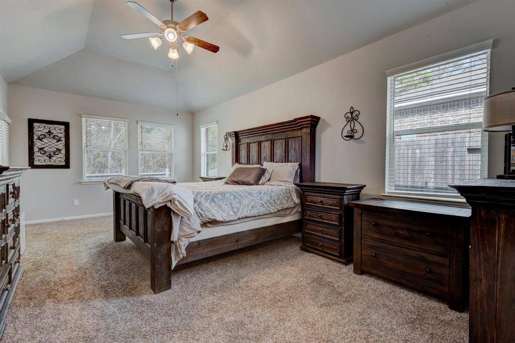 Walk into this oversized primary bedroom.  Bedroom offers a private door directly to the back yard and has a view of the back yard.