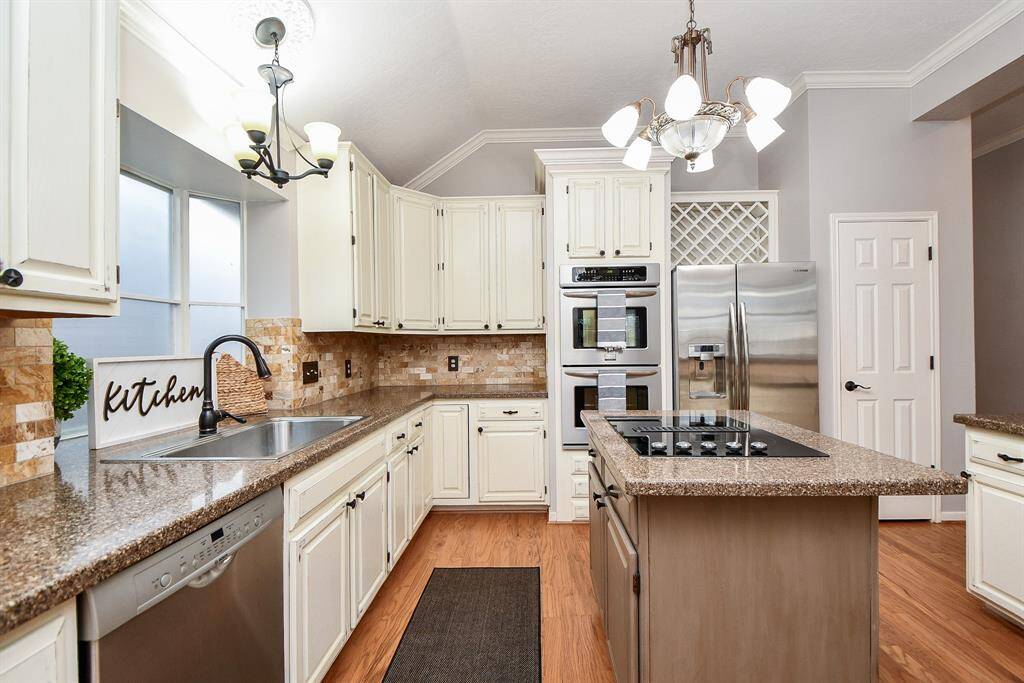 Built-in wine rack above refrigerator.