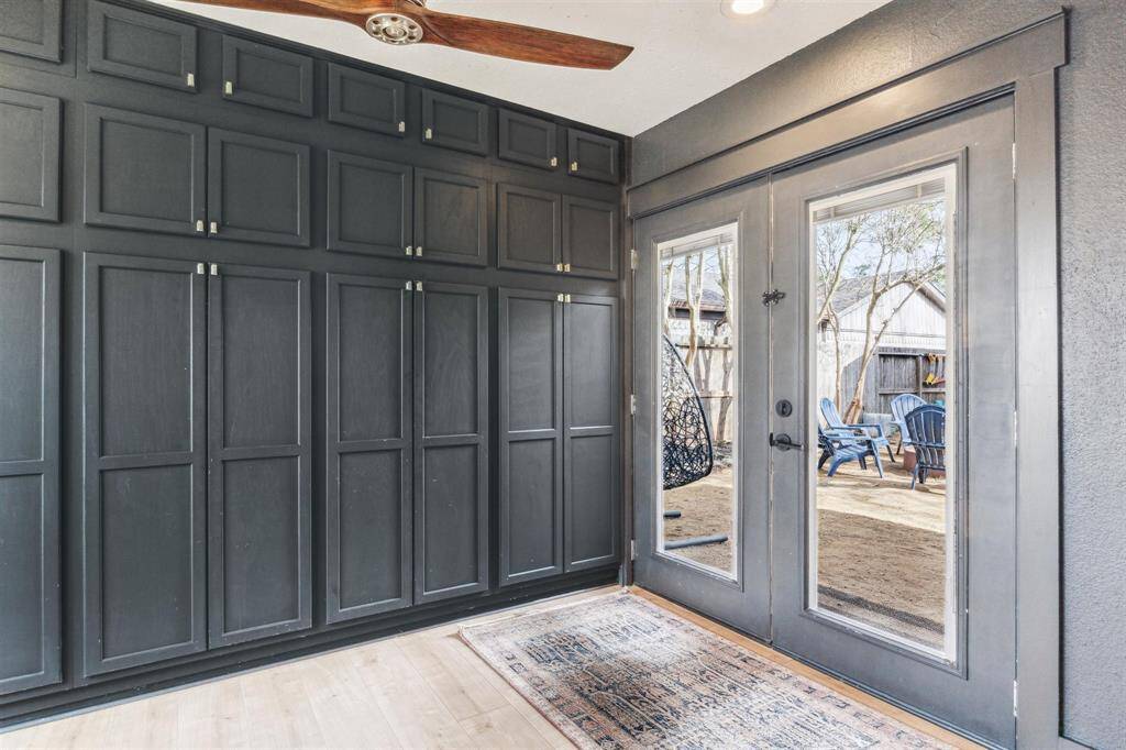 LOOK AT ALL OF THIS STORAGE! French doors leading to the courtyard.