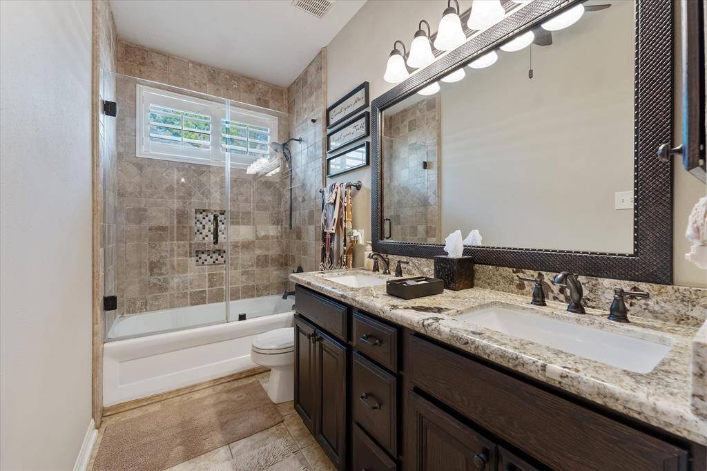 Second full bath with dual sinks and tub/shower combo.