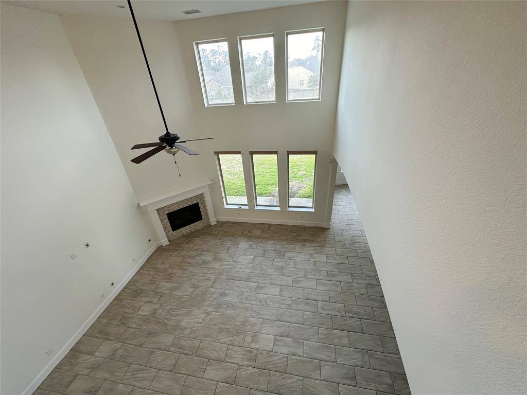 View of living room from upstairs balcony