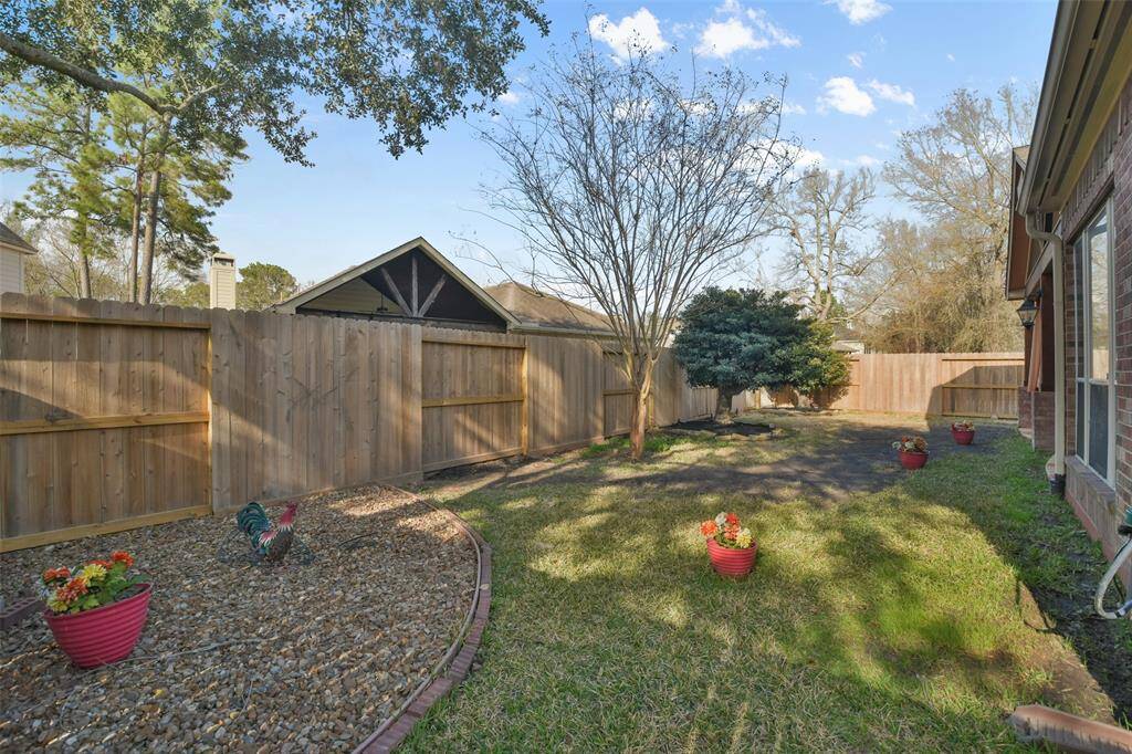 Low maintenance back yard with privacy fence.