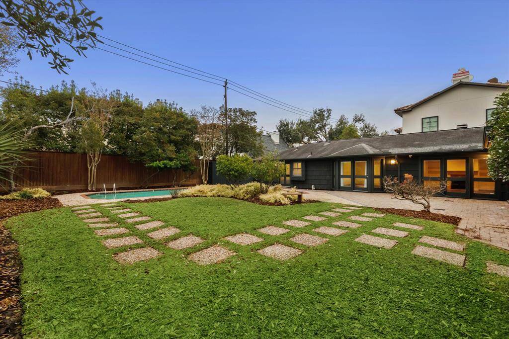 Fully fenced backyard with lots of greenspace for pets and play.