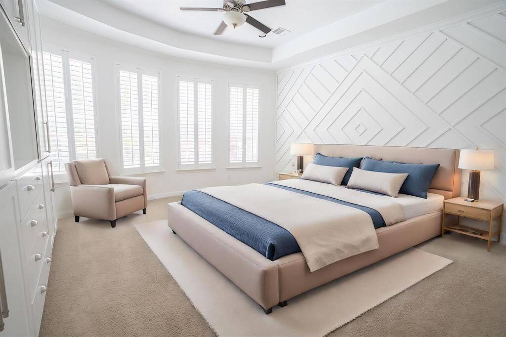 Primary suite with custom decorative wall (virtually staged)