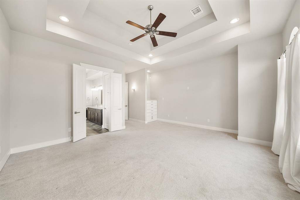 One last look at the owner's suite with the private bath accessible through the double-door entry as shown in the background.