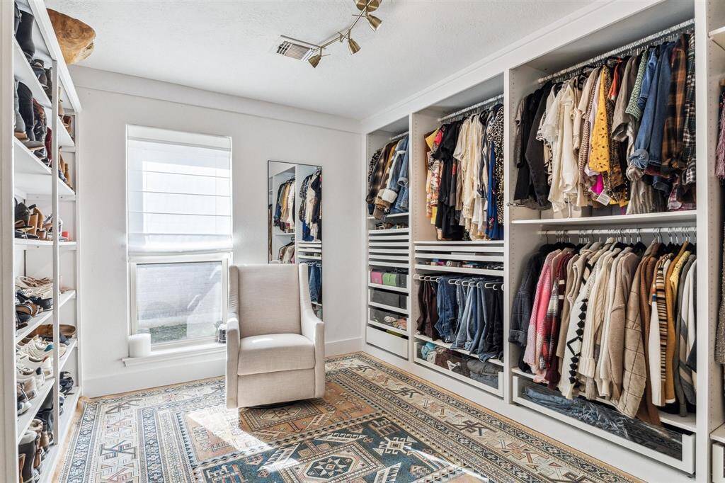 This 3rd bedroom is currently being used as a dressing room. It can easily be converted back to a bedroom.