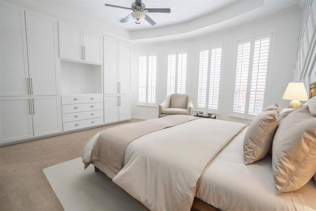Primary suite with custom built in cabinetry (virtually staged)
