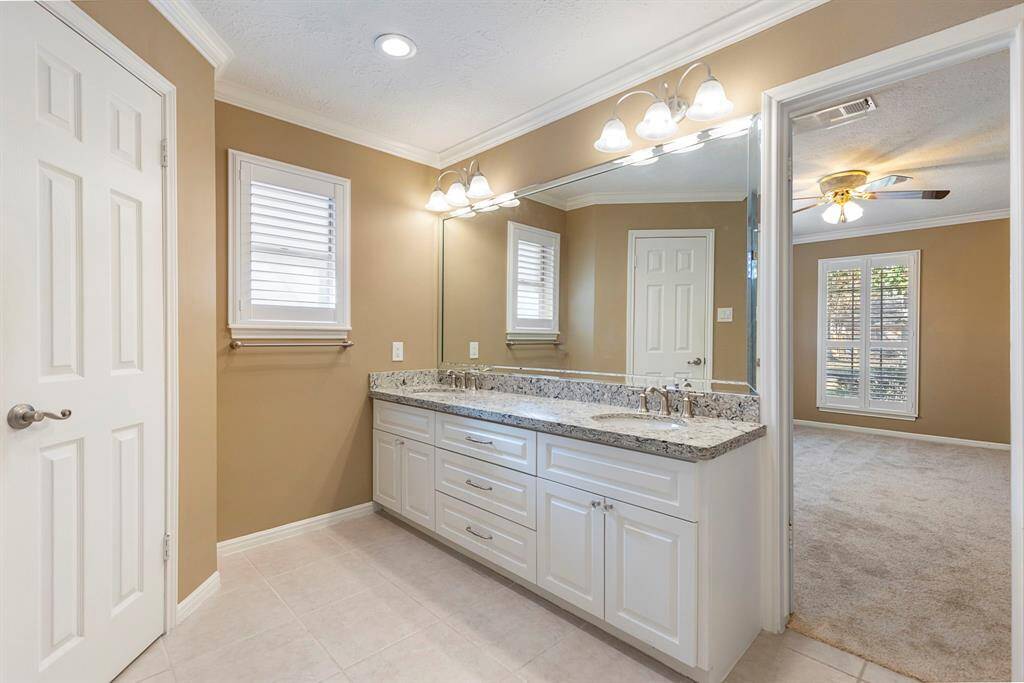 The primary bathroom has been recently updated granite countertops, double sinks and new tile.