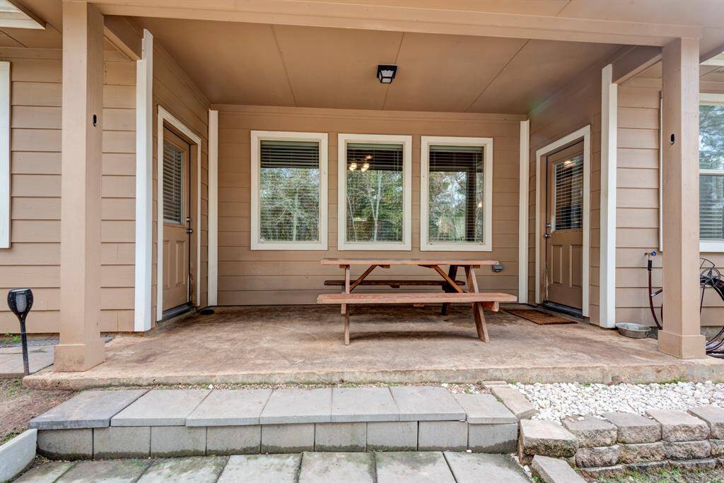 Covered patio offers ample room for your new Blackstone or BBQ pit.