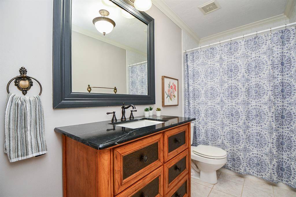 Lovely secondary full bathroom with upgraded vanity, mirror and fixtures.