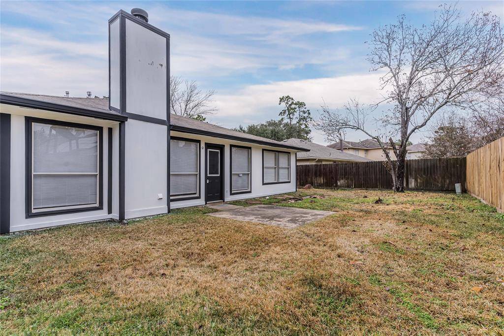 Inviting backyard view of the home, offering ample space for outdoor enjoyment.