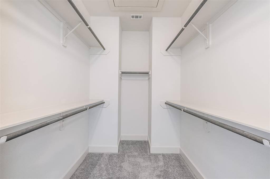 Primary bedroom has two walk in closets.