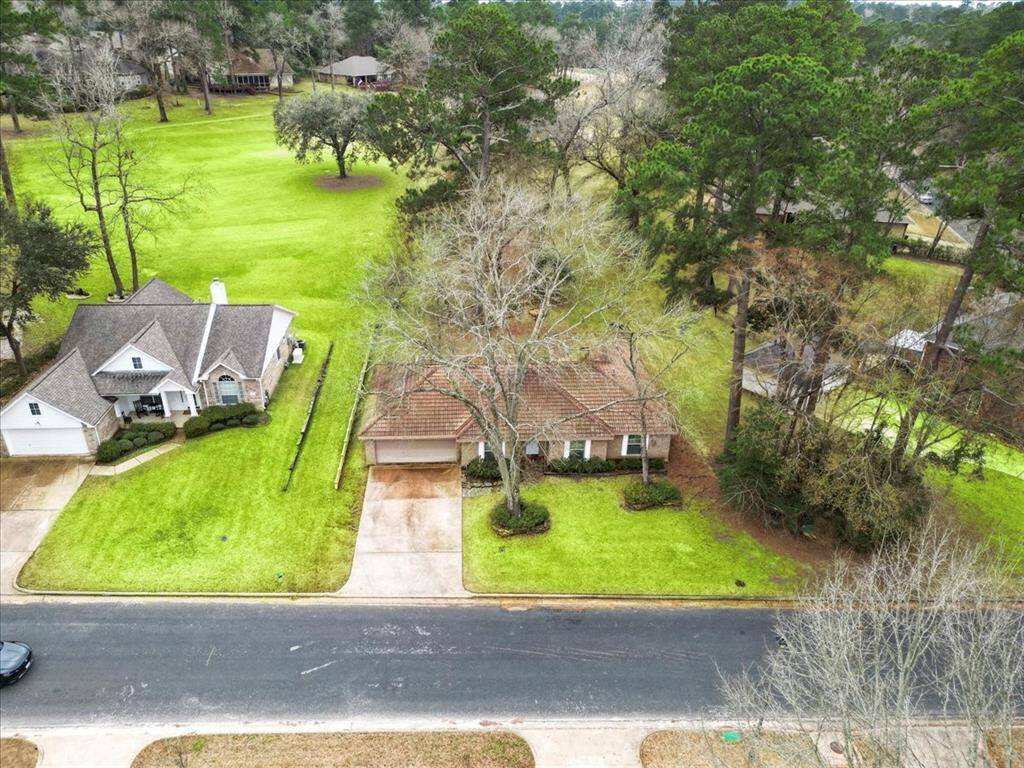 This home is adjacent to The Lakes #5 fairway.
