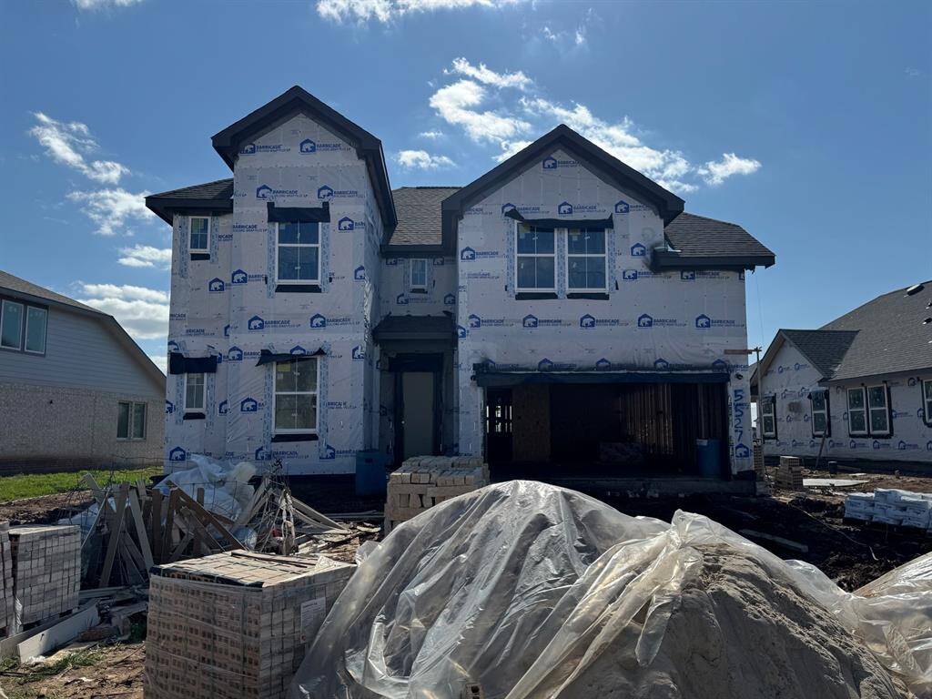 Two story home with 5 bedrooms, 4.5 baths, and 3 car garage.