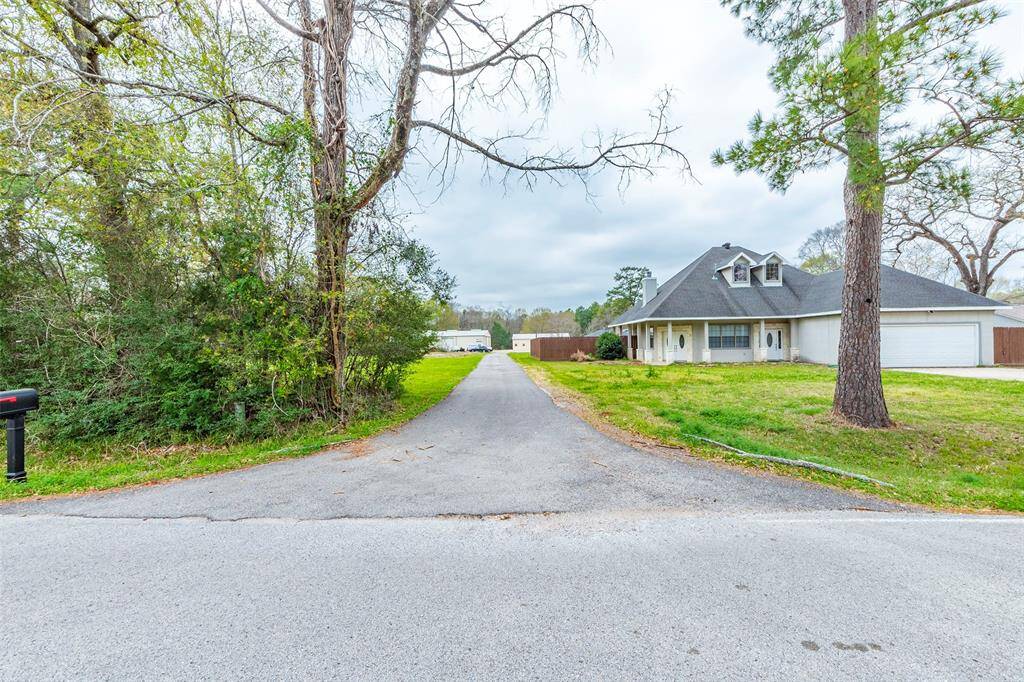 This driveway takes you to the back of the property. There is a separate driveway for the house in the front.