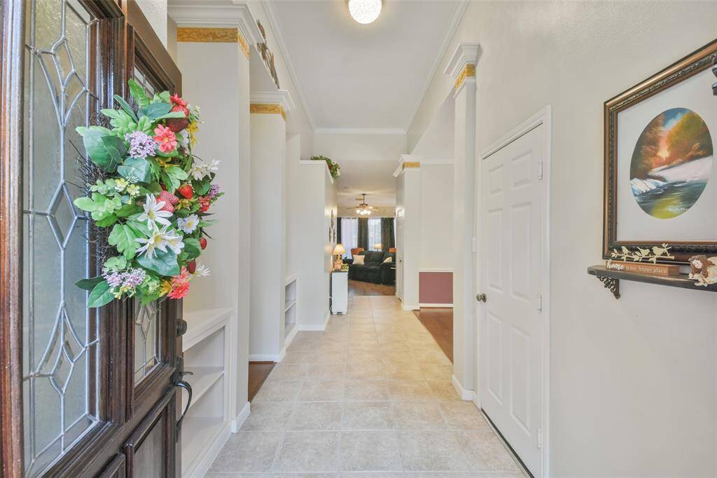 Step inside to tall ceilings as tile and hardwoods flow throughout the home.