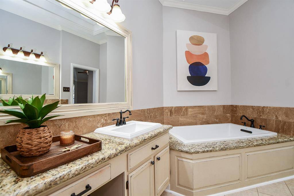 Gorgeous large soaking tub and skylight.