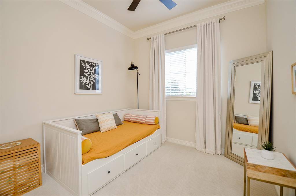 Here is the other secondary bedroom set up with a day bed.  Again, new carpet, paint and ceiling fan complete this charming room.
