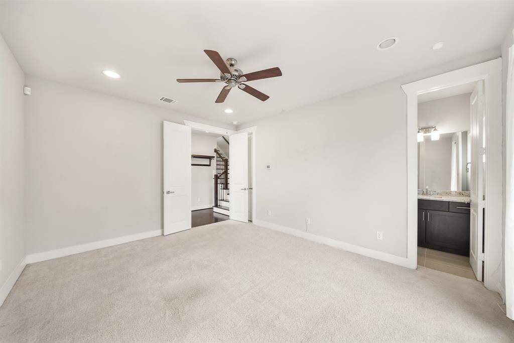 Perfect as a third bedroom, this space with an en-suite bath could easily serve as a study/home office.